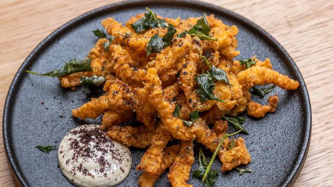 Salt bush and pepper berry fried crocodile with smoked oyster aioli tastes just like salt and pepper squid. Picture: Jake Nowakowski