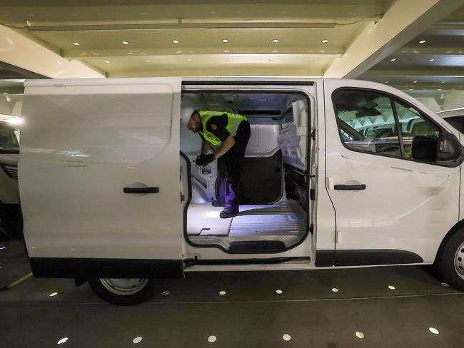 Australian Border Force Officers inspect vans for illicit drugs in a crackdown against organised crime networks. Picture: Ian Currie