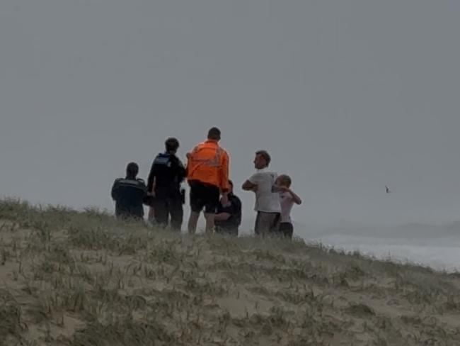 First responders searching for lost swimmers at Surfers Paradise.