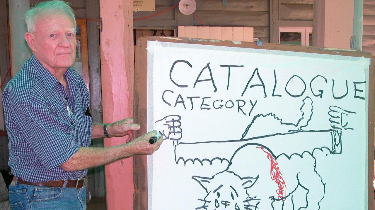 Sketch artist Tony Turton from Kingaroy produces one of his cat cartoons at the Bunya Picnic. Photo Ray Humphrys / Dalby Herald