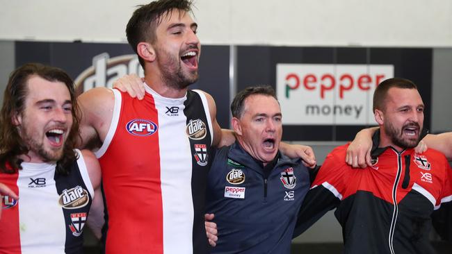 St Kilda coach Alan Richardson sings the song with his players after their breakthrough win. Picture: Getty