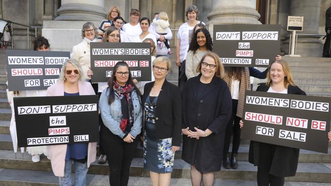 Protesters rallied at Parliament House on Monday to protest against the decriminalisation of sex work in SA. Pictured are survivor of the industry Annie and Bronwen Healy, with Labor MLC Claire Scriven and University of NSW sex work researcher Dr Helen Pringle. Picture: Dean Martin