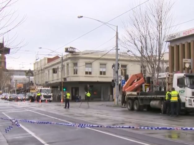 Police at the corner of Bridge Rd and Church St where Herald Sun journalist Sam Landsberger was hit by a truck. Picture: 7News