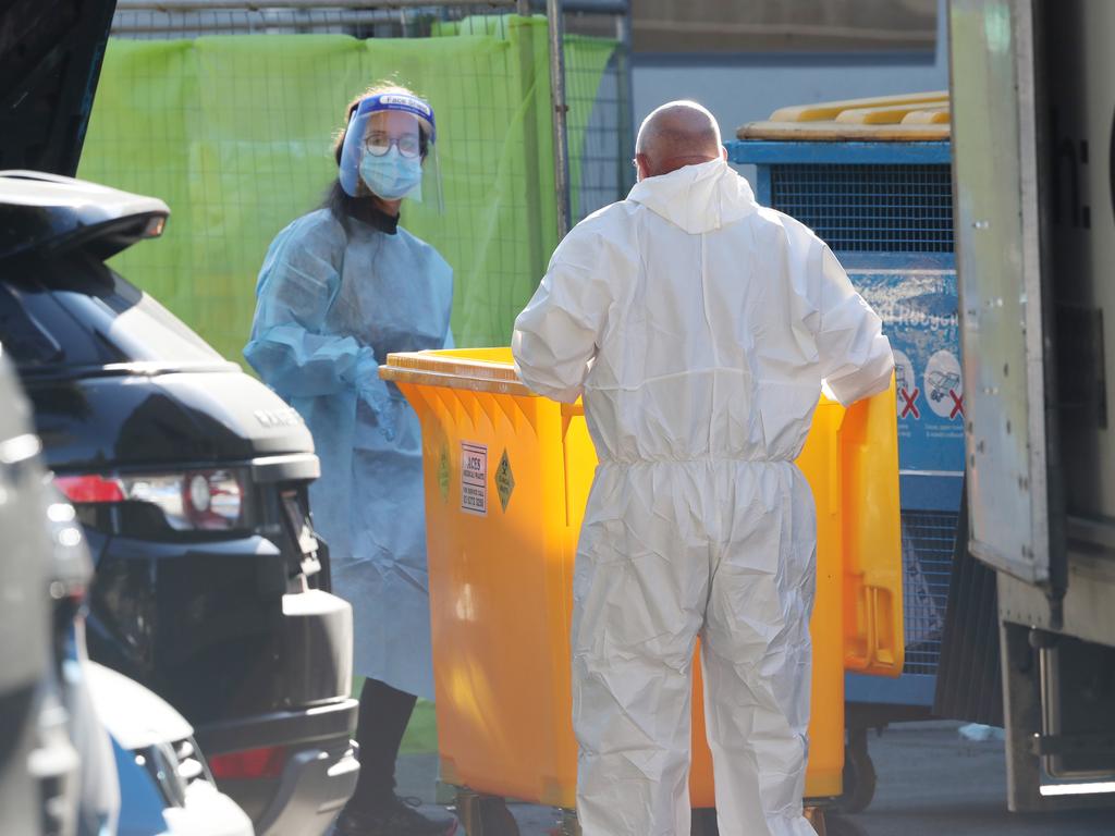 Staff at Arcare Maidstone removing medical waste. Picture: David Crosling