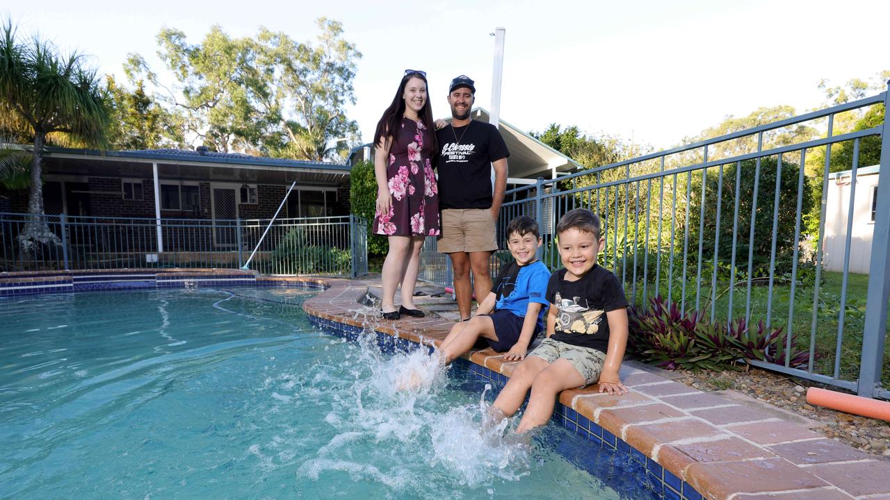 Lauren and Tyson Halliwell, with their kids Ethan Halliwell 6yrs, Jamie Halliwell 5yrs, have just moved into their new Park Ridge home while becoming investors, deciding keep their first home in Logan, Park Ridge South, on Tuesday 16th April 2024 - Photo Steve Pohlner