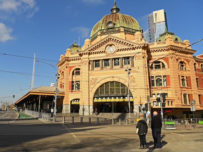 MELBOURNE, AUSTRALIA - AUGUST 10: An empty Flinder Street Station is seen on August 10, 2020 in Melbourne, Australia.  Metropolitan Melbourne  is under stage 4 lockdown restrictions, with people only allowed to leave home to give or receive care, shopping for food and essential items, daily exercise and work while an overnight curfew from 8pm to 5am is also in place. The majority of retail businesses are also closed. Other Victorian regions are in stage 3 lockdown. The restrictions, which came into effect from 2 August, have been introduced by the Victorian government as health authorities work to reduce community COVID-19 transmissions across the state. (Photo by Quinn Rooney/Getty Images)