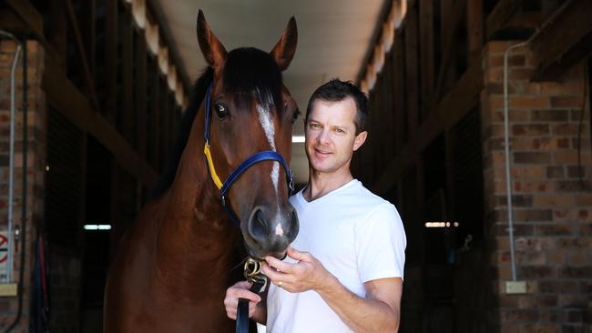 Pictured is Horse Trainer Jason Deamer with Unbeaten race horse Bon Amis, in Newcastle. Picture: Tim Hunter.