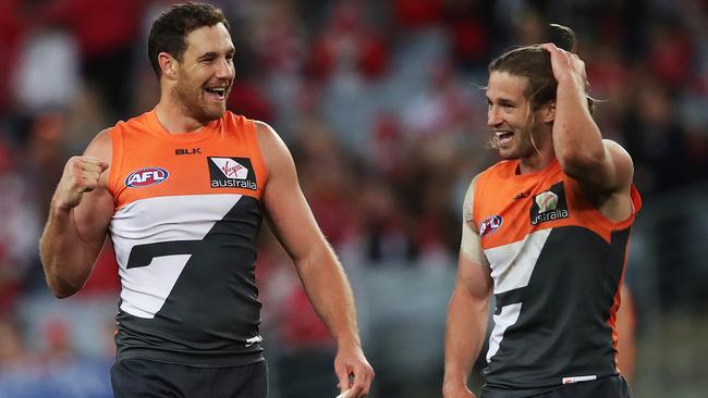 Shane Mumford celebrates with captain Callan Ward after beating Sydney. Picture: Phil Hillyard