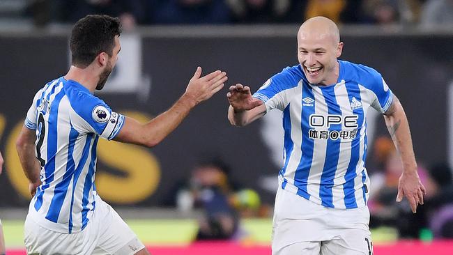 Australia’s Aaron Mooy (right) celebrates with teammate Tommy Smith after scoring Huddersfield’s second goal at Wolverhampton. Photo: Getty Images