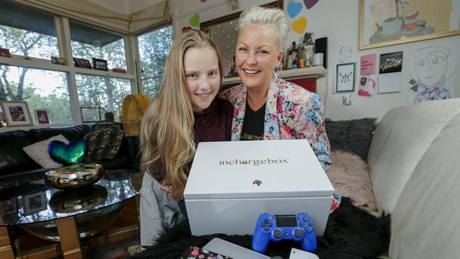 Surrey Hills mum Kate Curry has invented the inchargebox – a lockable box that can charge multiple devices at once. Pictured with her daughter Ella. Picture: Wayne Taylor