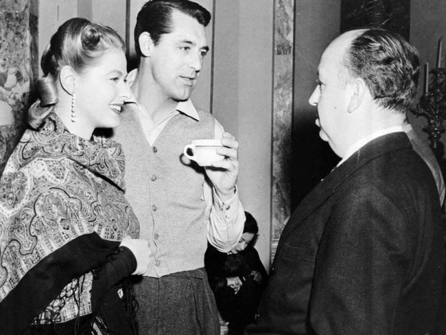 Actors Ingrid Bergman and Cary Grant talk with director Alfred Hitchcock after completing the last scene of the 1946 film Notorious. Picture: AP