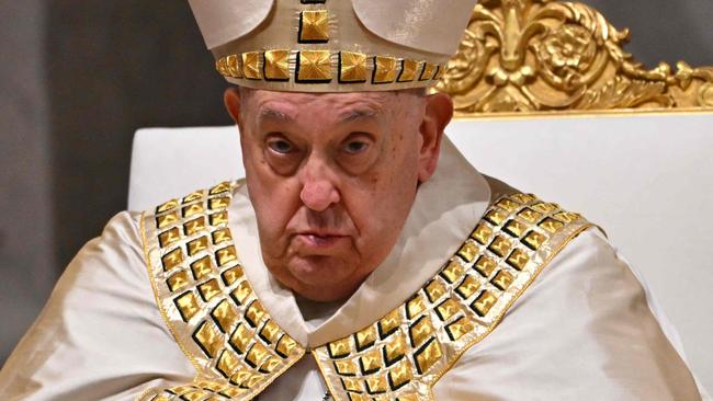 (FILES) Pope Francis leads a mass during the first Vespers and the Te Deum prayer as part of the New Year's celebrations in Saint Peter's Basilica, at the Vatican, on December 31, 2024. Pope Francis was admitted to hospital in Rome on February 14, 2025 for tests and treatment for ongoing bronchitis, the Vatican announced. (Photo by Andreas SOLARO / AFP)