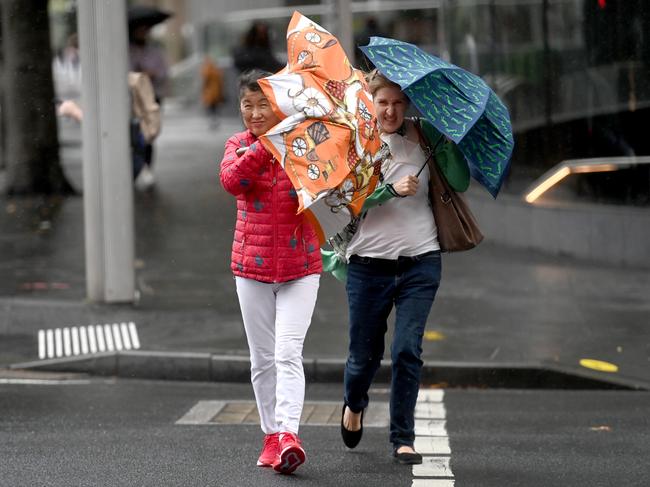 Sydney-siders battle winds and rain across the city. Picture: NCA NewsWire / Jeremy Piper