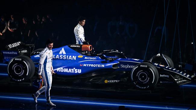 Williams' drivers Carlos Sainz (front) and Alex Albon with the new Atlassian-branded car.