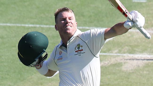 BRISBANE, AUSTRALIA - NOVEMBER 22: David Warner of Australia celebrates bringing up one hundred runs during day two of the 1st Domain Test between Australia and Pakistan at The Gabba on November 22, 2019 in Brisbane, Australia. (Photo by Jono Searle - CA/Cricket Australia via Getty Images)