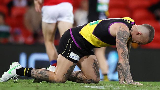 AFL Round 18. Richmond v Brisbane at Metricon stadium, Gold Coast . 16/07/2021.   Richmonds Dustin Martin on all 4s after getting injured in a collision with Mitch Robinson of the Lions  late 3rd qtr   .  Pic: Michael Klein