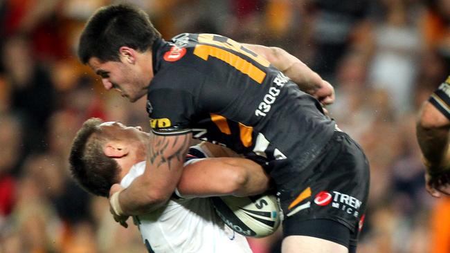 Simon Dwyer tackles Jared Waerea-Hargreaves during Wests Tigers v Sydney Roosters NRL qualifying final at the SFS in Sydney.