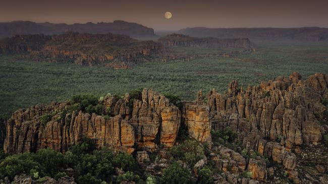 A full moon rises over the Kakadu escarpment. Picture: Tourism NT