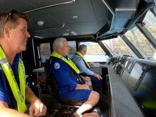 Marine Rescue members behind the wheel of the Lord Howe 40.