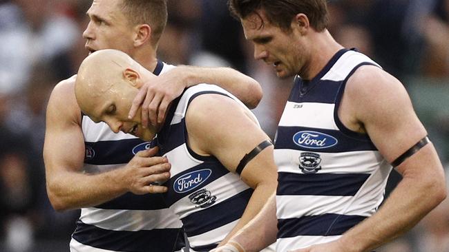 Gary Ablett of the Cats (centre) celebrates a goal with Joel Selwood (left) and Patrick Dangerfield during the Round 5 AFL match between the Hawthorn Hawks and the Geelong Cats at the MCG in Melbourne, Monday, April 22, 2019. (AAP Image/Daniel Pockett) NO ARCHIVING, EDITORIAL USE ONLY