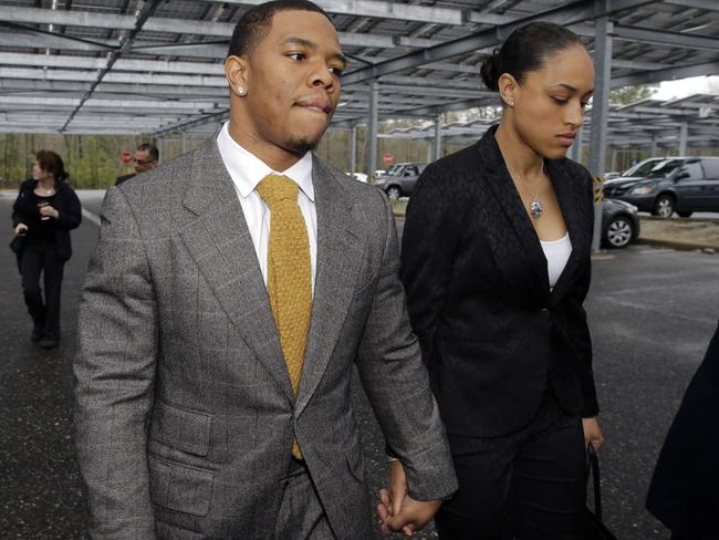 Knocked her out cold with a punch ... Sacked Baltimore Ravens running back Ray Rice holds hands with his wife, Janay. Picture: Mel Evans
