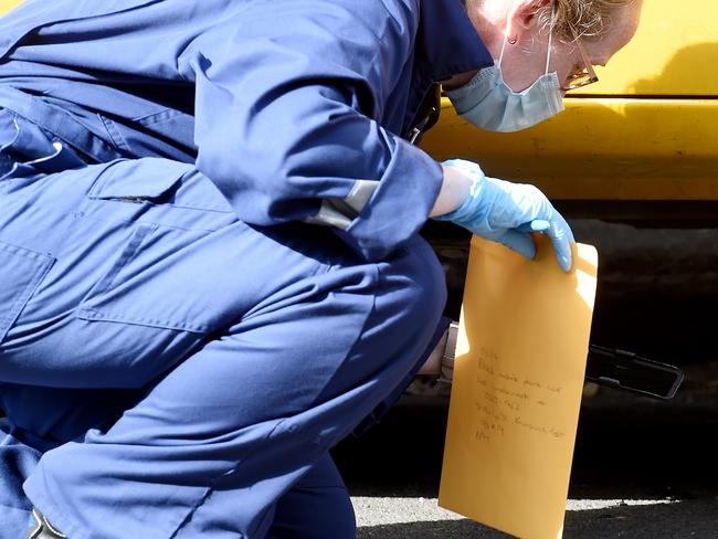 Police collect evidence at the scene. Picture: Nicole Garmston