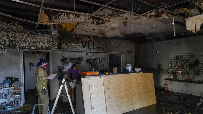 Vet nurses Jordi Shearer and Dora Williams inside the burned out Pets Health Hilton Vet Centre at Hilton. Picture: RoyVphotography