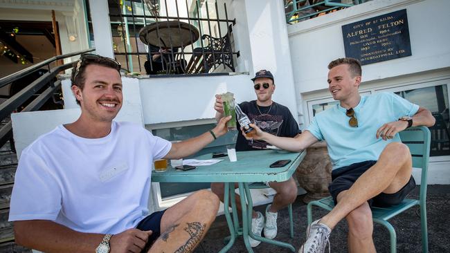 Friends enjoy a drink at The Esplanade Hotel in St Kilda on Wednesday in Melbourne. Photo by Darrian Traynor/Getty Images