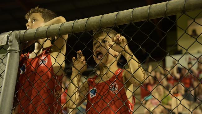 Spectator Allessio Ayres cheers on his team at the opening game of the NTFL 22/23 season. Picture: (A)manda Parkinson