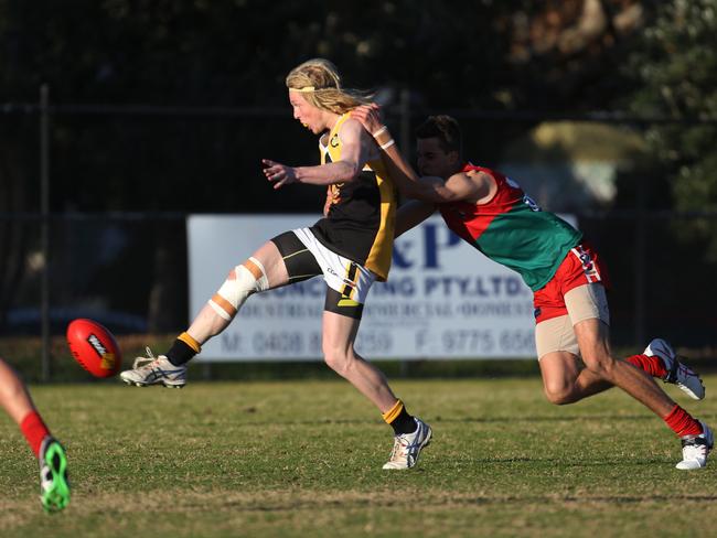 Angus Wright takes a kick for Frankston YCW. Picture: Stuart Milligan