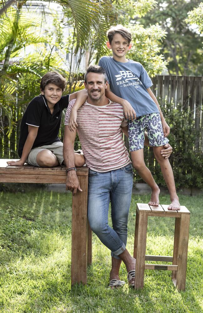 Lee Carseldine at home with his sons Sam, 12 and Jake 14. Picture: Mark Cranitch.