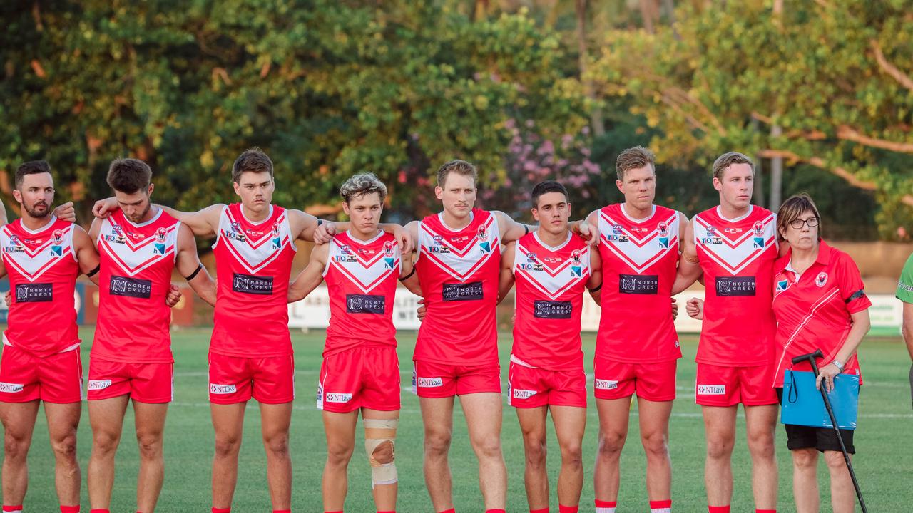 Waratahs observe a 30 second silence to commemorate the life of lost mate Alexander Aurrichio as history made at Gardens Oval with the first game under lights as Waratahs V Palmerston. Picture GLENN CAMPBELL