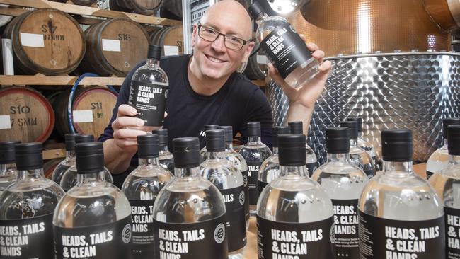 Cameron McKenzie with sanitiser that the Four Pillars Gin Brewery started making during the pandemic Picture: Rob Leeson.