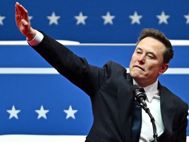 Tesla and SpaceX CEO Elon Musk gestures as he speaks during the inaugural parade inside Capitol One Arena, in Washington, DC, on January 20, 2025. (Photo by ANGELA WEISS / AFP)