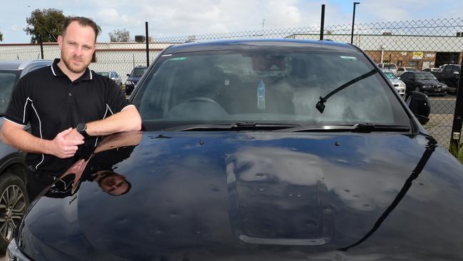 Peter Kittle Toyota collision manager Chad Buckley with a customer’s hail-damaged car at Para Hills West on Friday. Picture: Michael Marschall