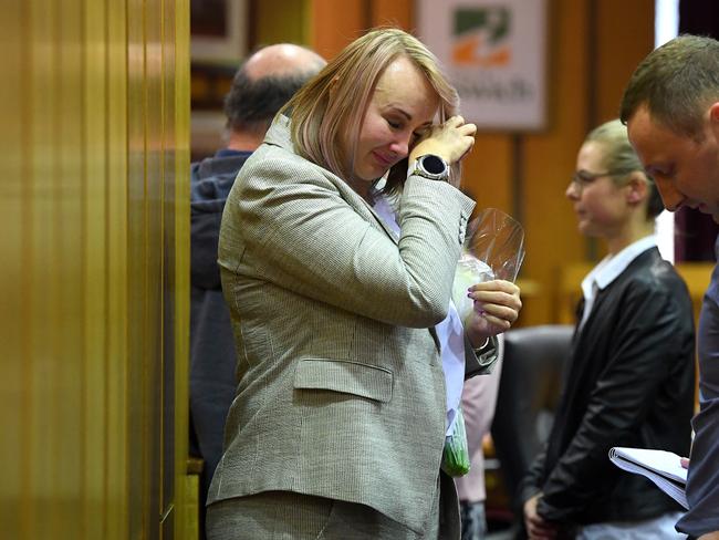 Cr Cheryl Bromage wipes away tears following the Ipswich City Council's final meeting at the Ipswich City Council Chambers in Ipswich, Monday, August 20, 2018. The Queensland government will on Tuesday introduce laws to sack the entire council and appoint administrators after a corruption probe saw 15 people, including two former mayors, charged with 86 offences. (AAP Image/Dave Hunt) NO ARCHIVING