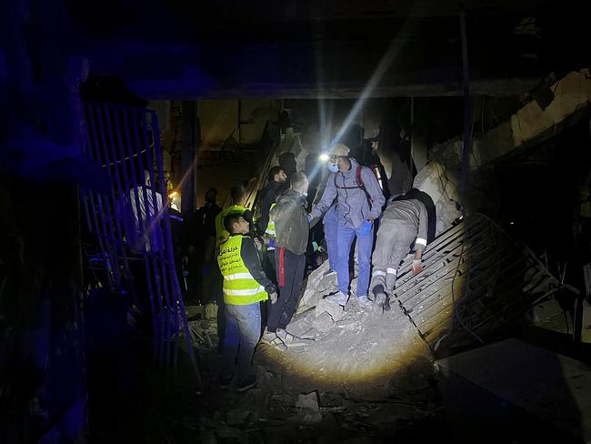 Members of the Lebanese emergency services works at the site of an Israeli strike that targeted Zuqaq al-Blat neighbourhood in Beirut. Picture: AFP