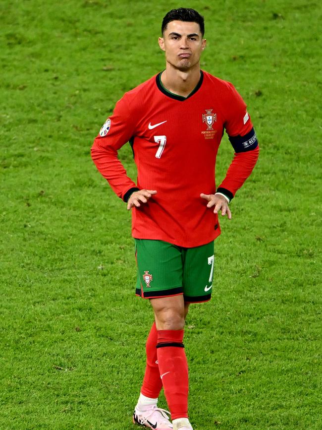 Cristiano Ronaldo of Portugal celebrates scoring the team's first penalty. (Photo by Dan Mullan/Getty Images)