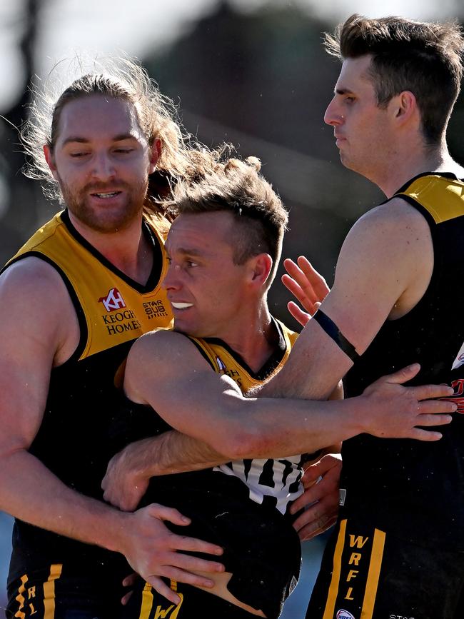 Werribee Districts’ Trent Lee was congratulated after he kicked a goal. Picture: Andy Brownbill