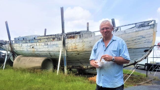 Wooden Boat Association of Cairns member Tom Sparks stands near the Floria. The 1915-built wooden pearl lugger is owned by the Cairns Maritime Museum but has been rotting away on the Wooden Boat Association of Cairns' property for the best part of a decade, and is about to be dismantled and crushed by Ports North. PICTURE: CHRIS CALCINO