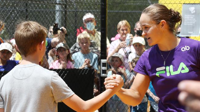 Ash Barty shakes hands with a young fan at Rebel Sport. Picture: Annette Dew