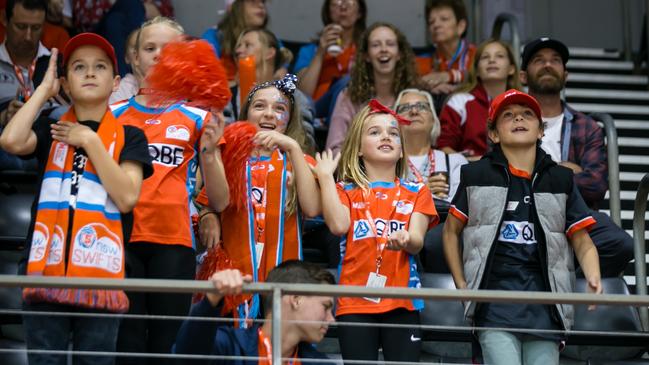 Briony Akle cheer squad in the stands at a Swifts game.