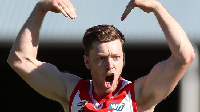 Tom Mills celebrates during one of Ararat’s recent grand final wins. Picture Yuri Kouzmin