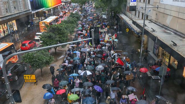 Protesters walk through the CBD. Picture : Ian Currie