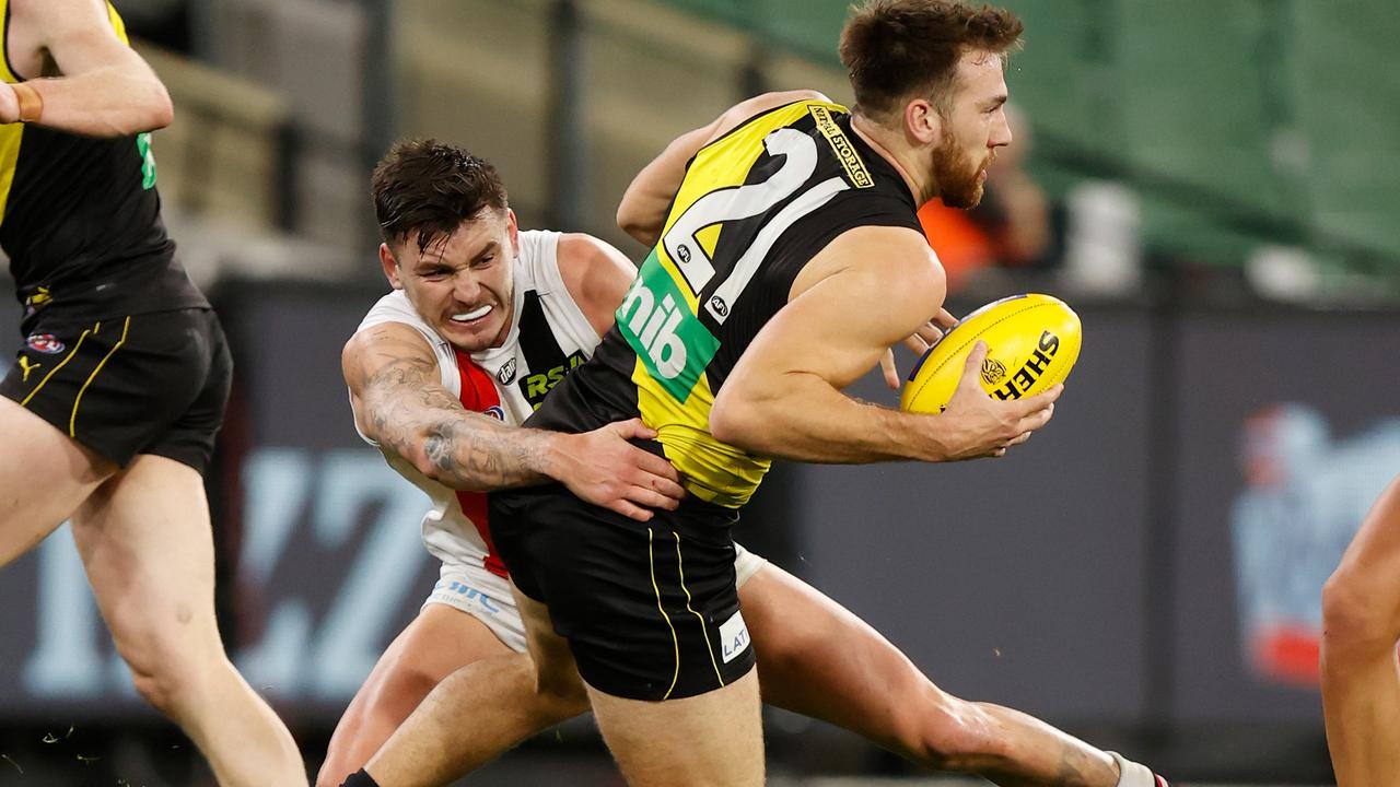 Noah Balta injures his leg as Josh Battle lays a tackle on him at the weekend.