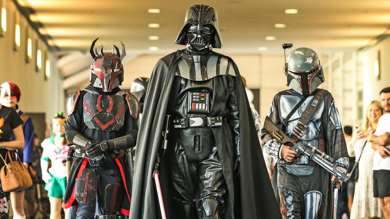 Bob McDonnell, 14 and Elliott Keating, 14 walk alongside Darth Vader played by Michael Beckwith at the Oz Comic-Con from the Brisbane Exhibition &amp; Convention Centre. Picture: Zak Simmonds