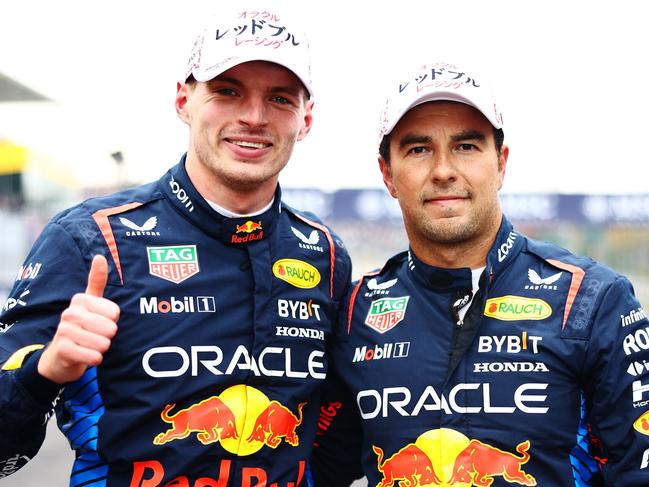 SUZUKA, JAPAN - APRIL 06: Pole position qualifier Max Verstappen of the Netherlands and Oracle Red Bull Racing and Second placed qualifier Sergio Perez of Mexico and Oracle Red Bull Racing celebrate in parc ferme during qualifying ahead of the F1 Grand Prix of Japan at Suzuka International Racing Course on April 06, 2024 in Suzuka, Japan. (Photo by Mark Thompson/Getty Images)