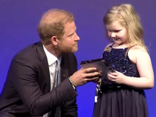 Harry speaking with a little girl at a previous WellChild Awards. Picture: Supplied