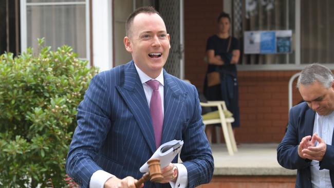 SQM Research says national residential property listings fell in November by 2.6 per cent. Above, auctioneer Andrew Cooley at work last weekend in Sydney. Picture: Simon Bullard