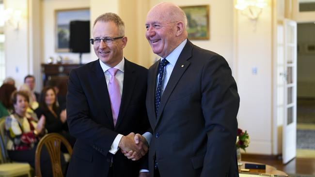 Paul Fletcher MP (left) shakes hands with Australian Governor-General Sir Peter Cosgrove after being sworn-in as Australian Families Minister during a ceremony at Government House in Canberra, Tuesday, August 28, 2018. (AAP Image/Lukas Coch)